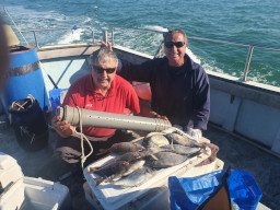 Two Anglers with catch of Black Bream